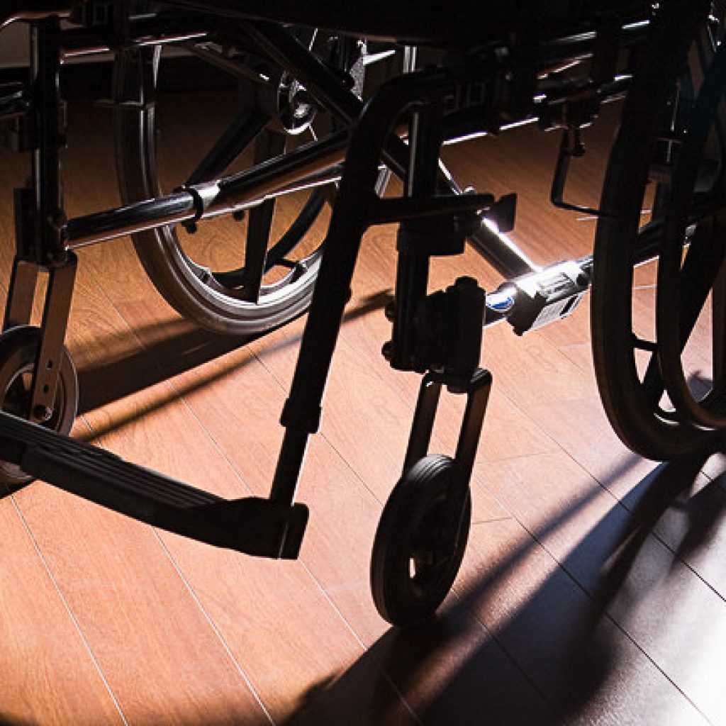 Wheelchair on a wooden floor Wheelchair on a wooden floor